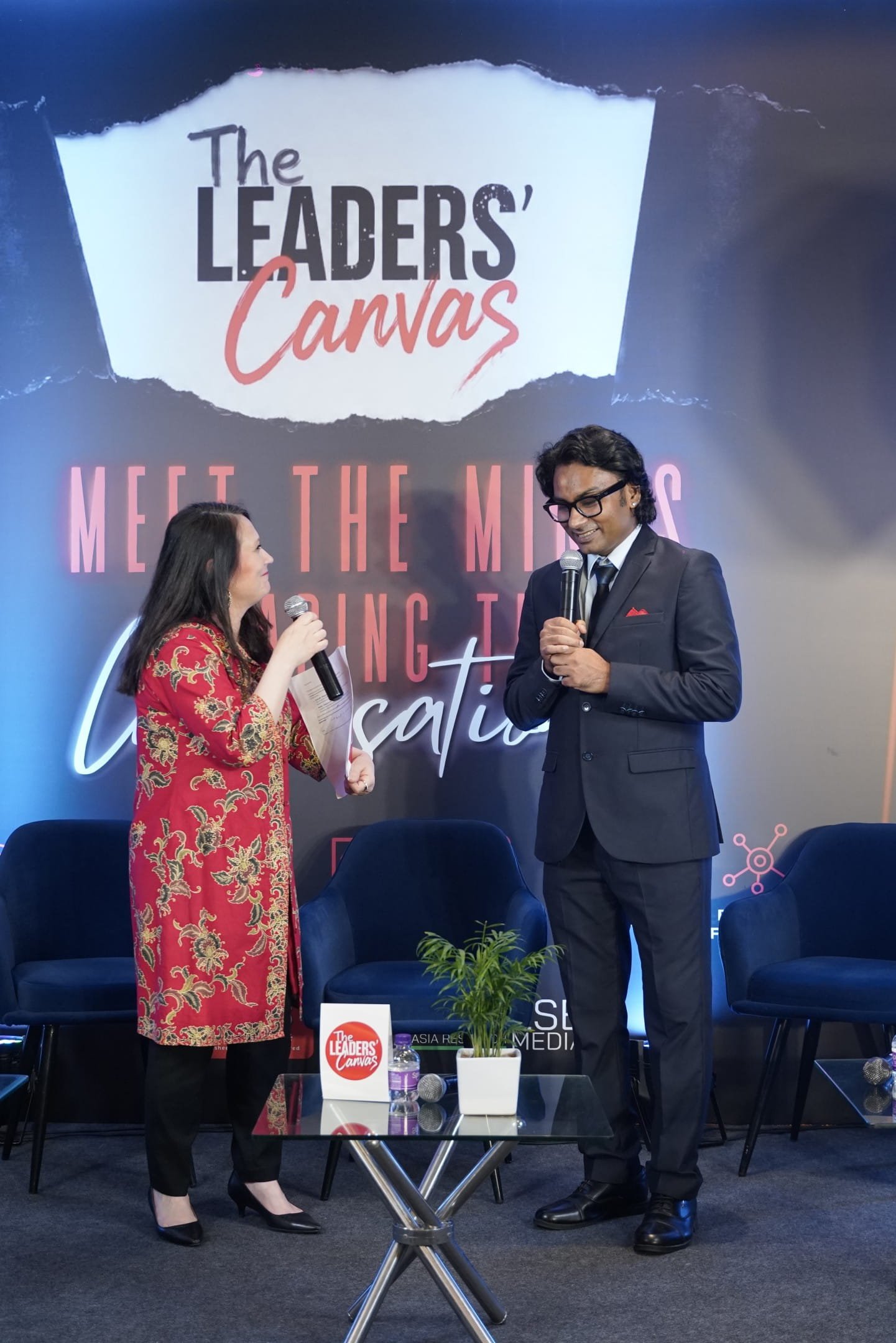 Host interview on stage at The Leaders' Canvas Delhi 2026 leadership forum